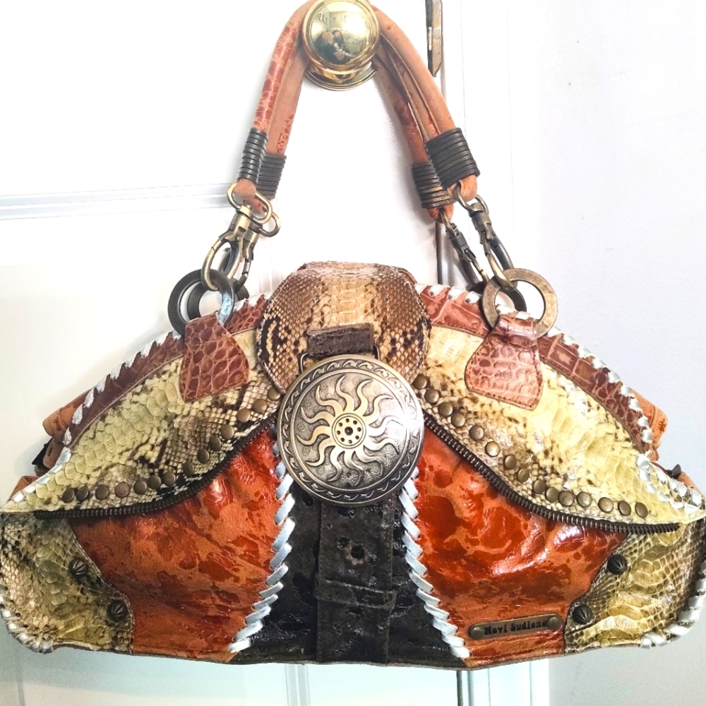 Unique, one of a kind, leather and snake skin bag by Novi Sudiono.
